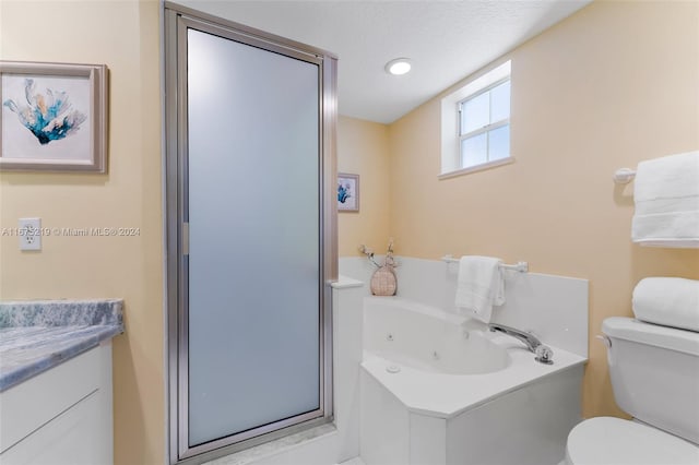 full bathroom featuring vanity, toilet, a textured ceiling, and plus walk in shower