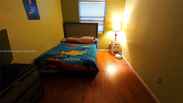 bedroom featuring hardwood / wood-style floors