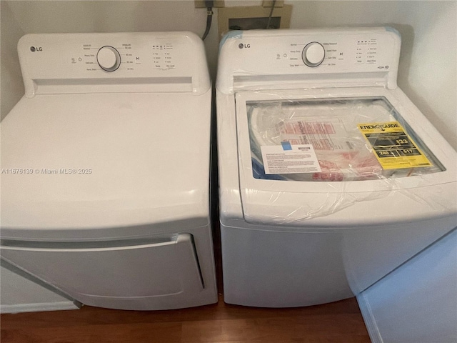 washroom featuring independent washer and dryer and hardwood / wood-style flooring