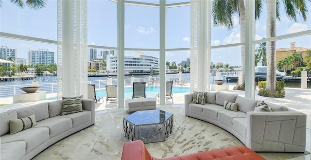 sunroom / solarium with a water view