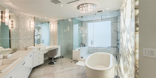 bathroom featuring plus walk in shower, a chandelier, and vanity