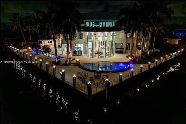 exterior space with a water view and a patio area