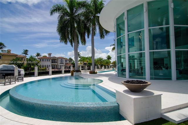 view of pool featuring a patio