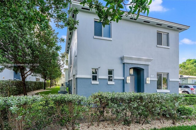 rear view of property with a lawn