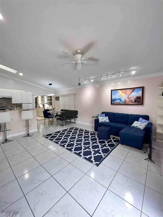 tiled living room with ceiling fan, ornamental molding, vaulted ceiling, and pool table