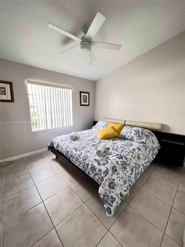 bedroom featuring tile patterned floors and ceiling fan