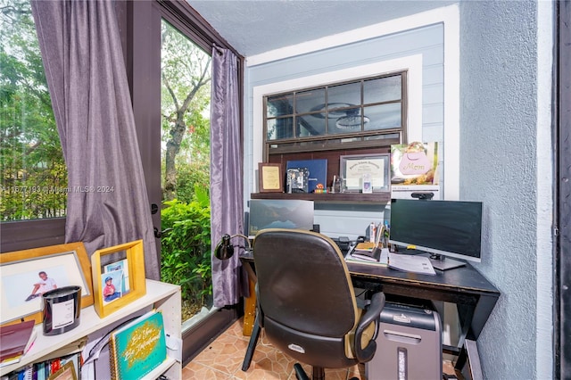 office space with a textured ceiling