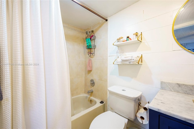 full bathroom featuring vanity, shower / bath combo with shower curtain, and toilet