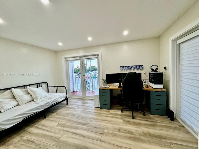 office area featuring french doors and light hardwood / wood-style flooring