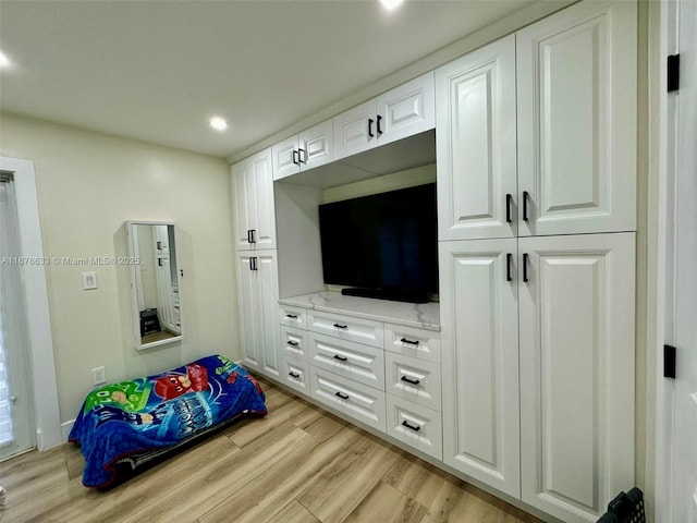 bedroom with light hardwood / wood-style flooring