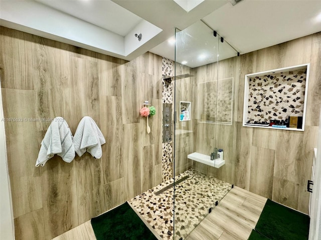 bathroom with tiled shower