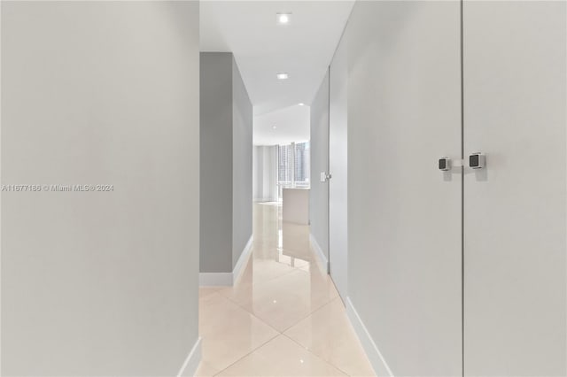 corridor with light tile patterned floors