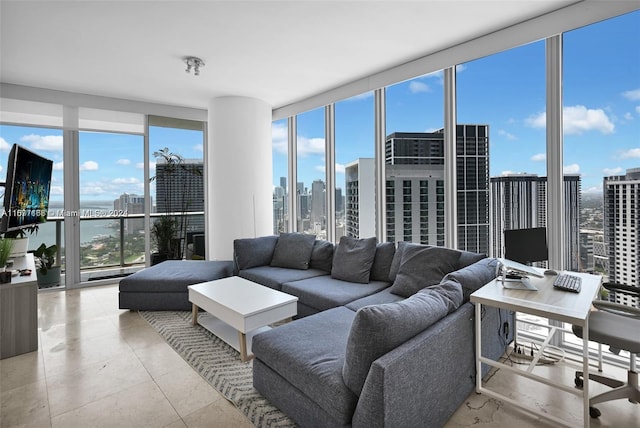 living room with expansive windows, light tile patterned floors, and plenty of natural light