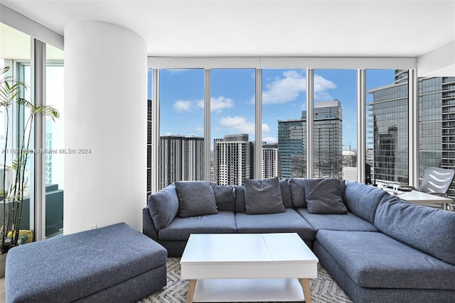 living room featuring plenty of natural light and floor to ceiling windows