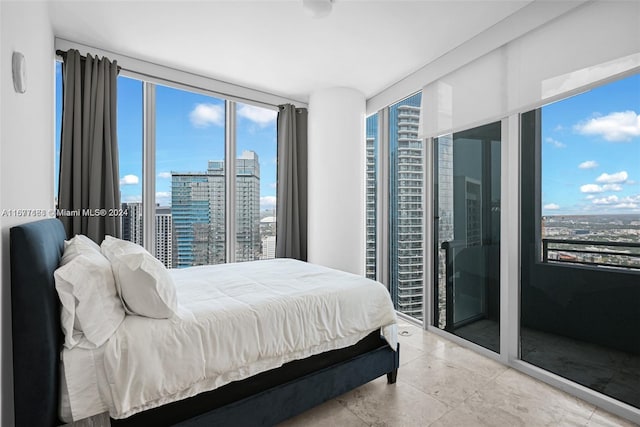 bedroom with floor to ceiling windows