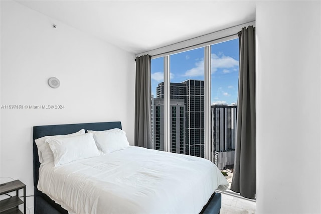 bedroom featuring a wall of windows