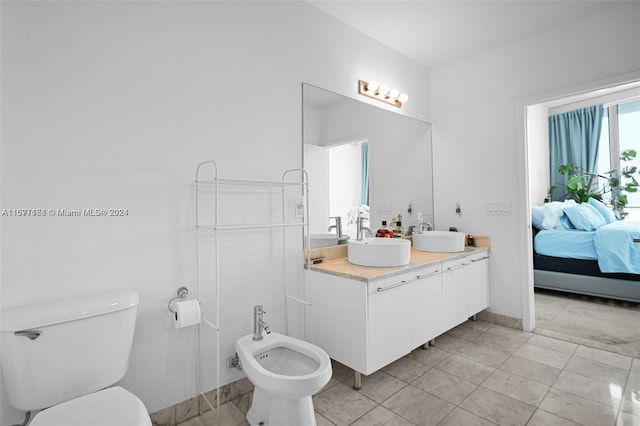 bathroom featuring vanity, a bidet, and toilet