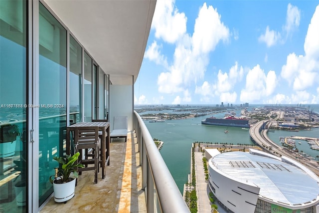 balcony featuring a water view