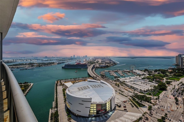 aerial view at dusk with a water view