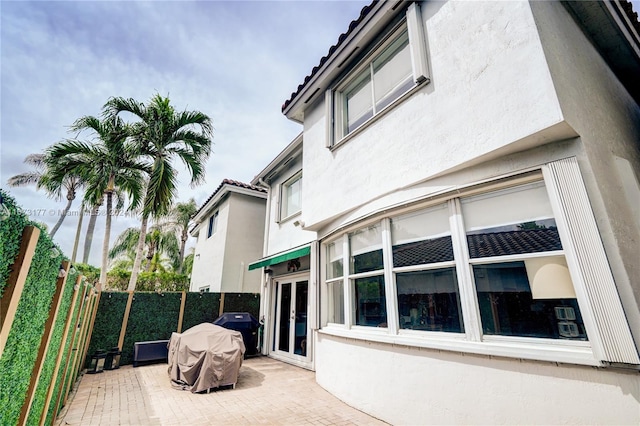 view of patio featuring a grill