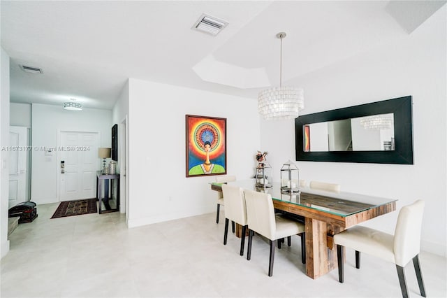 dining space featuring a chandelier