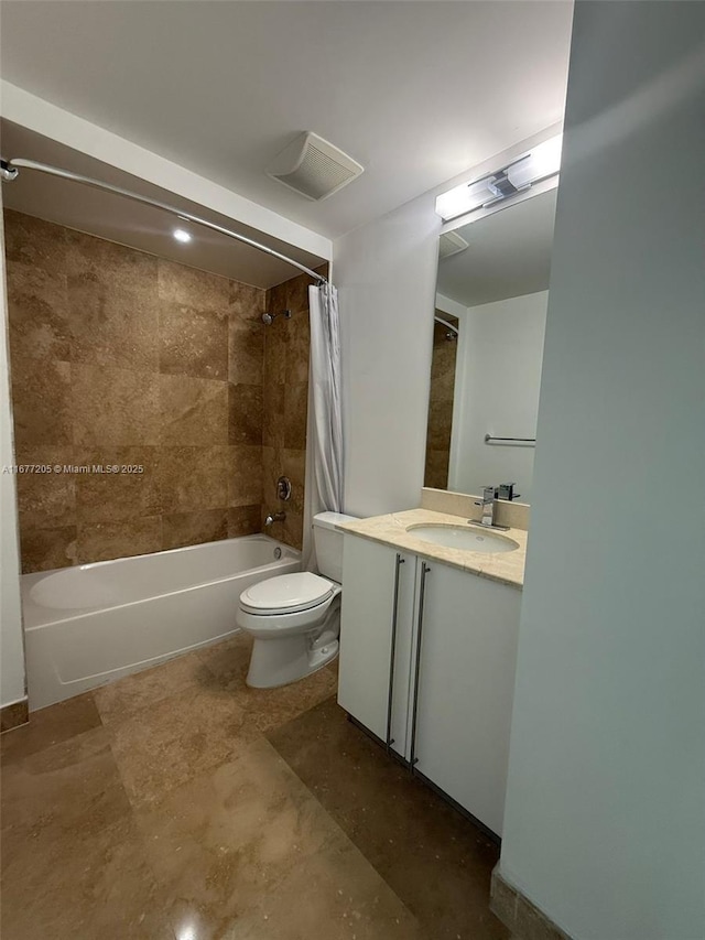 full bathroom featuring shower / tub combo with curtain, vanity, and toilet