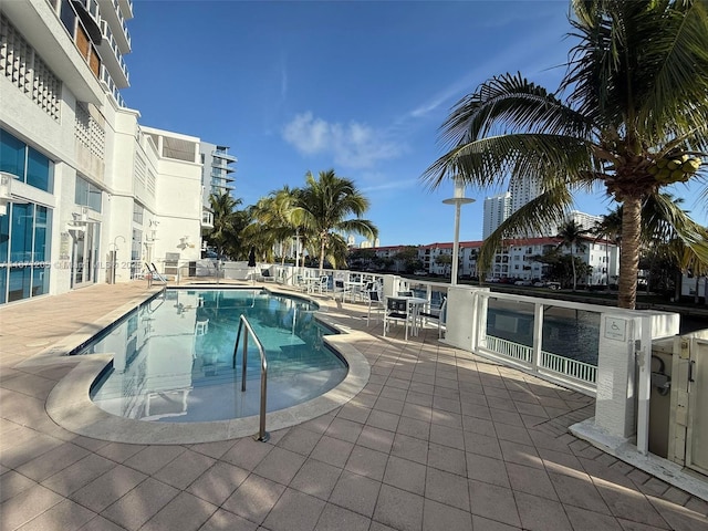 view of swimming pool featuring a patio