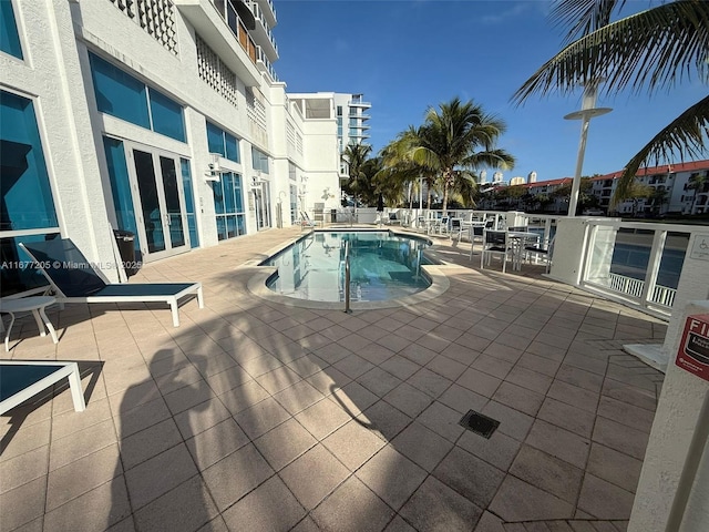 view of swimming pool featuring a patio area