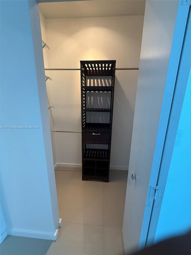 walk in closet featuring light tile patterned floors