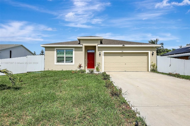 view of front facade with a front yard and a garage