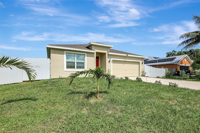 single story home with a front yard and a garage