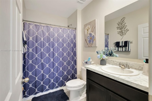 bathroom featuring vanity, curtained shower, toilet, and tile patterned floors