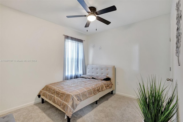 bedroom with ceiling fan and light colored carpet