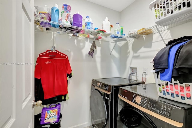 washroom featuring washing machine and dryer