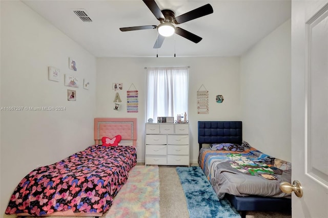 carpeted bedroom featuring ceiling fan