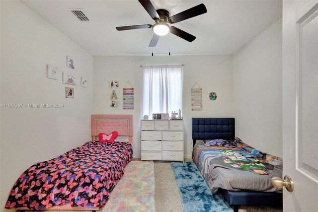 729 SW Lakehurst Dr, Port St Lucie, FL 34983 - carpeted bedroom featuring ceiling fan