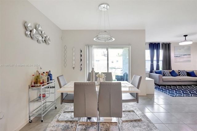 dining area featuring light tile patterned flooring