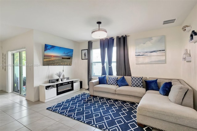 living room with tile patterned floors