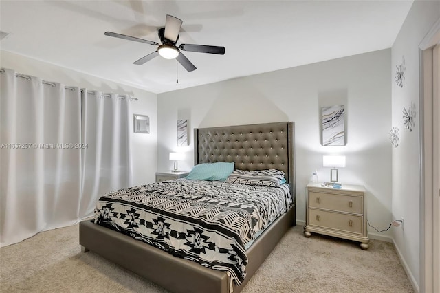 bedroom with light carpet and ceiling fan