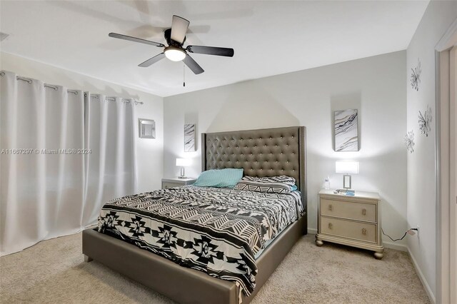 729 SW Lakehurst Dr, Port St Lucie, FL 34983 - bedroom with carpet flooring, baseboards, and ceiling fan