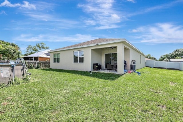 729 SW Lakehurst Dr, Port St Lucie, FL 34983 - rear view of house featuring stucco siding, a ceiling fan, and a patio area