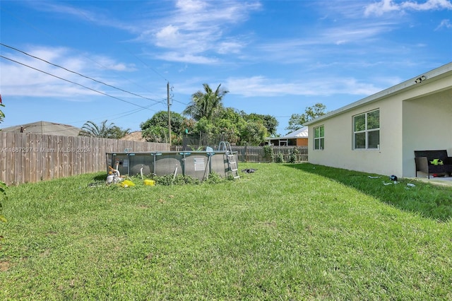 view of yard featuring a fenced in pool