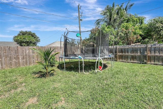 view of yard with a trampoline