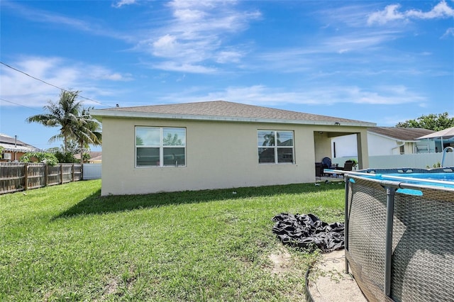 729 SW Lakehurst Dr, Port St Lucie, FL 34983 - back of house featuring stucco siding