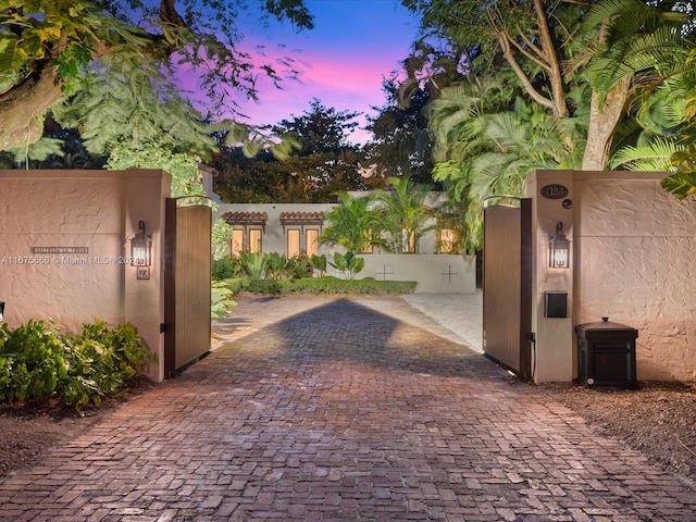 view of gate at dusk