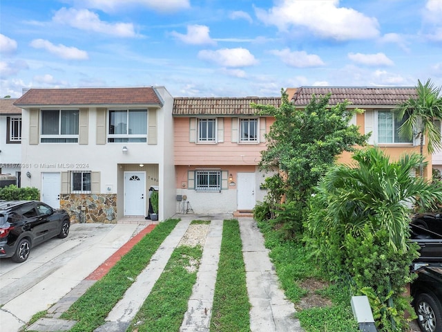 multi unit property featuring a garage