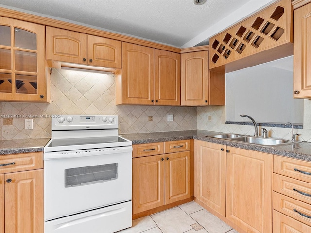 kitchen featuring decorative backsplash, a textured ceiling, sink, light tile patterned floors, and electric range