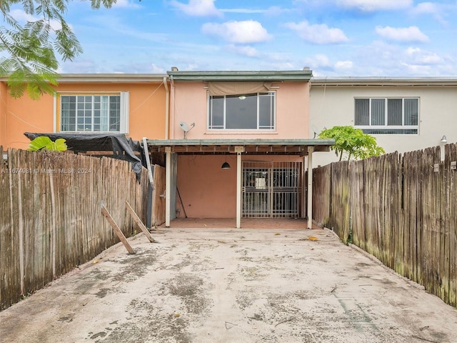 rear view of property with a patio area