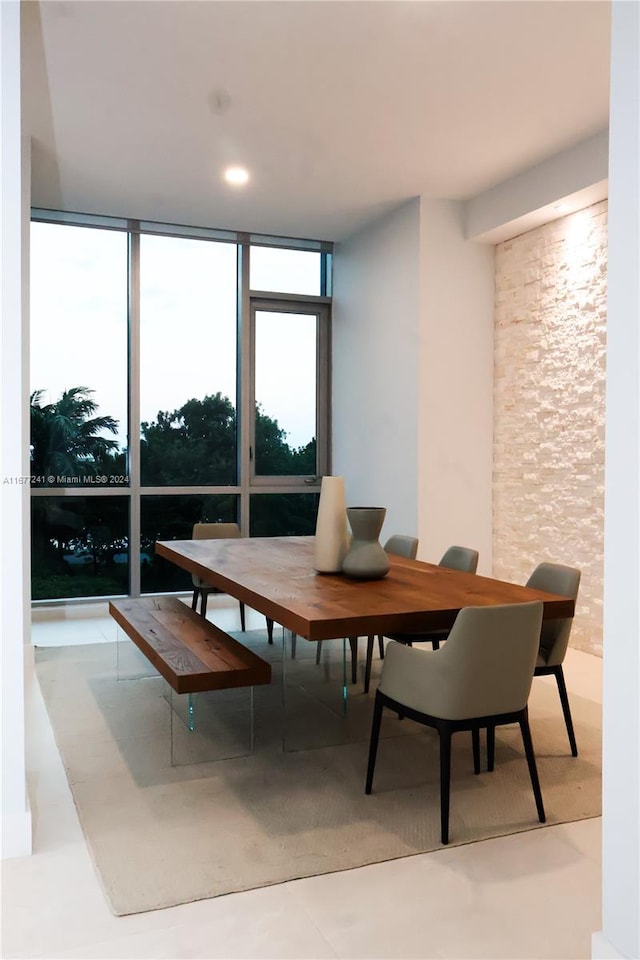 dining area featuring a wall of windows