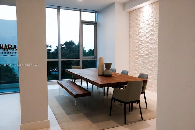 dining area featuring floor to ceiling windows